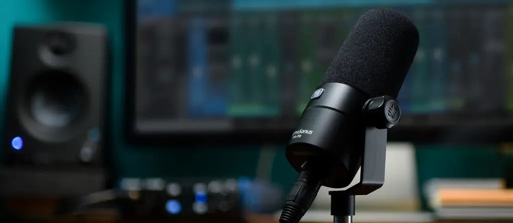 Microphone in a studio setting with audio equipment 
