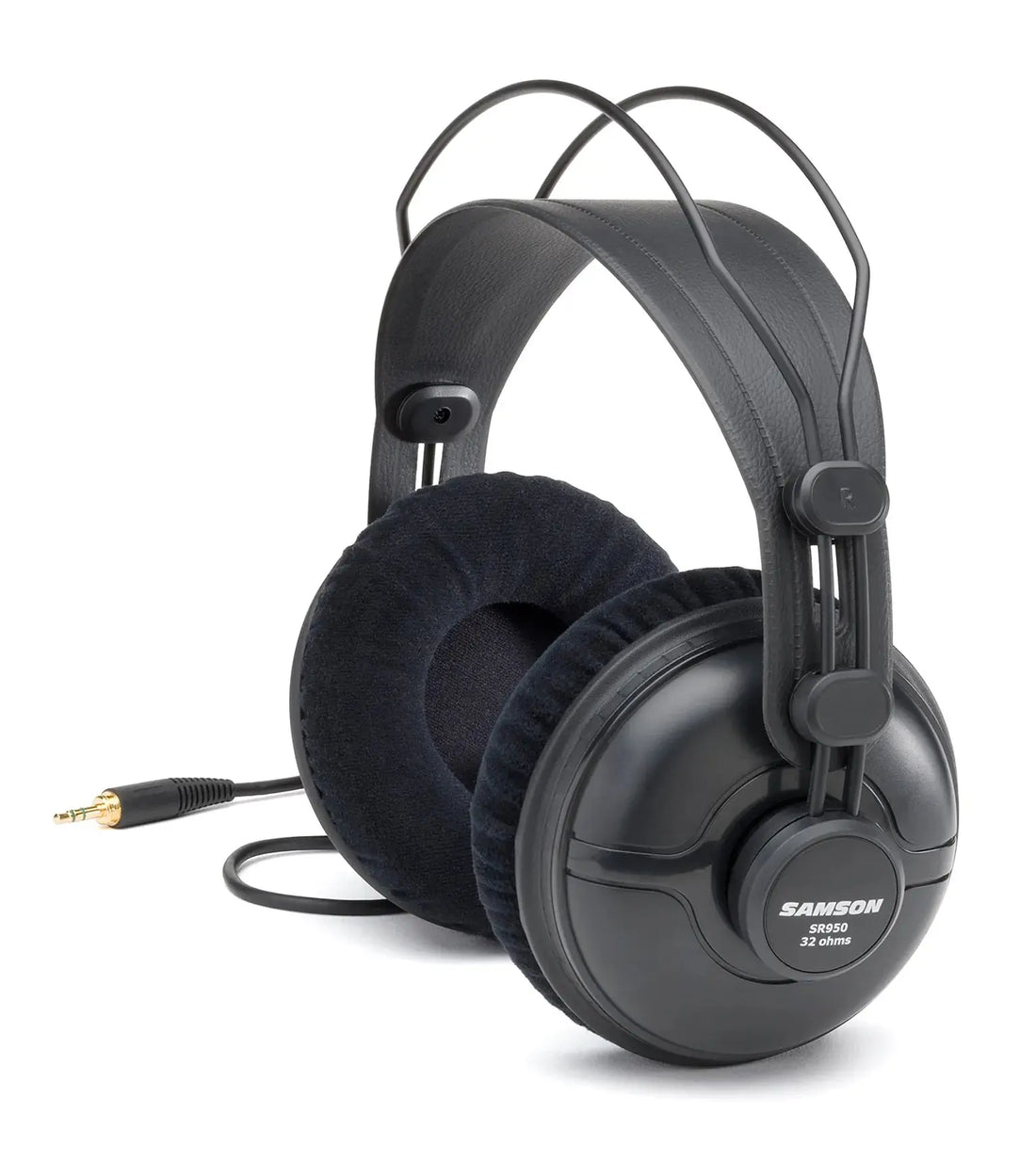 Samson SR950 studio headphones on mixing console in recording studio.
