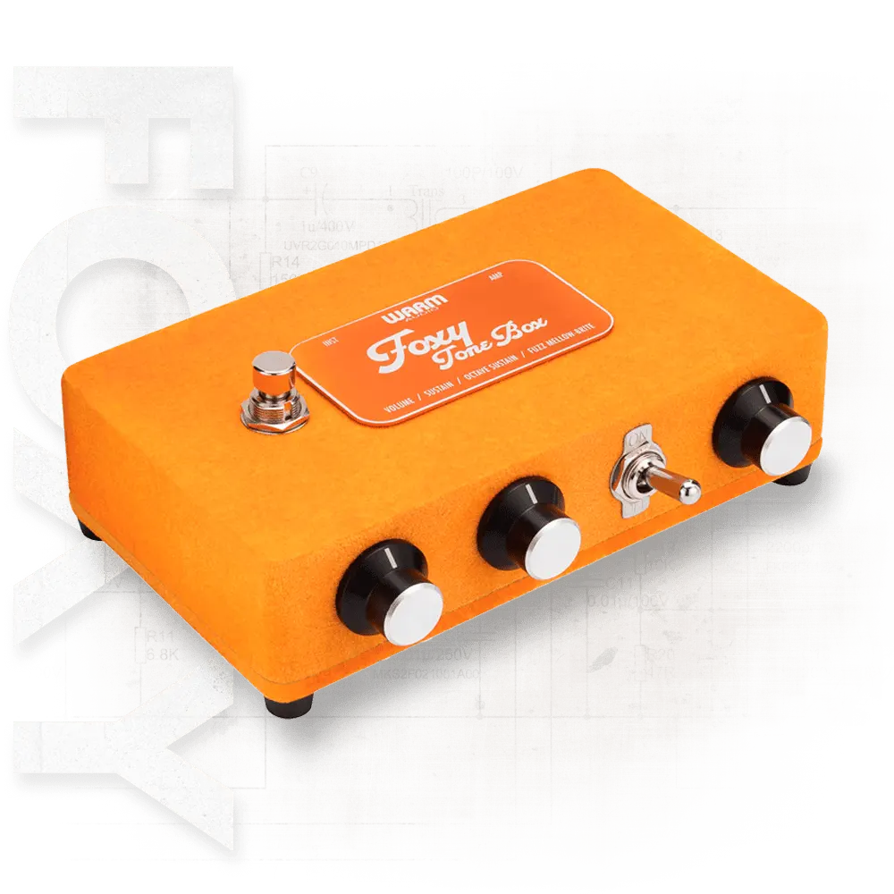 Orange guitar effects pedal with 'Foxy Tone Box' branding