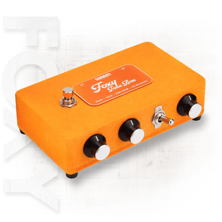 Orange guitar effects pedal with 'Foxy Tone Box' branding